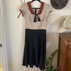 Stop Staring tan and black 1940s wiggle dress